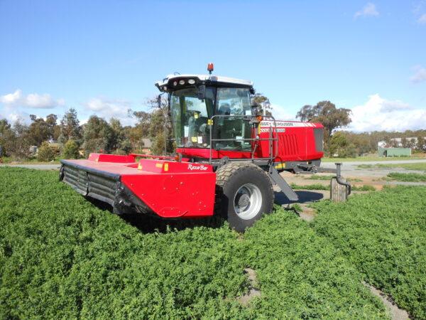 Self-Propelled Mower Conditioner and Operator - Image 5